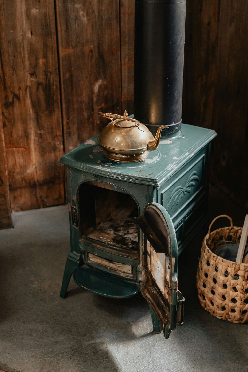A pot on a vintage green stove